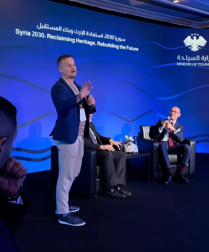 Nick Maddock addressing an audience at the 2026 Syria Travel Show in Damascus